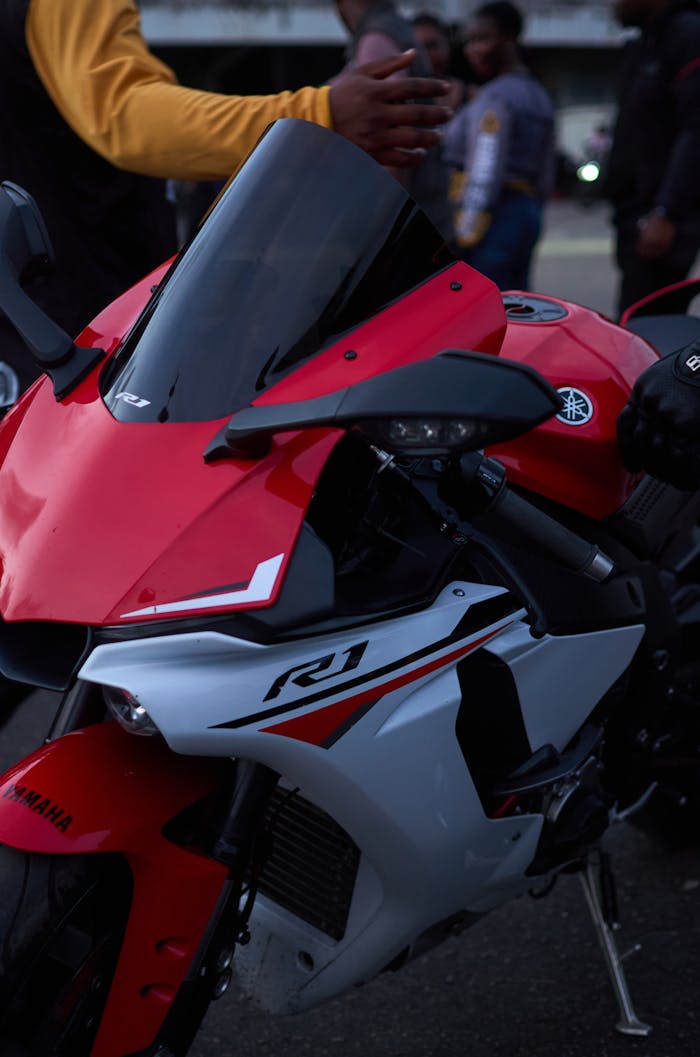 Close-up of a red Yamaha R1 motorcycle at a gathering in Lagos, capturing the vibrant biking community.